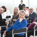 A group of adults have been discussing important things.